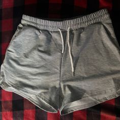 Have Pockets Brandnew Never Worn Gray Summer Athletic Shorts, Gray Leisure Athletic Shorts For Summer, Summer Leisure Gray Athletic Shorts, Gray Workout Shorts For Spring, Casual Gray Athletic Shorts For Summer, Gray Drawstring Shorts For Spring, Casual Gray Bottoms For Day Out, Trendy Gray Shorts With Elastic Waistband, Casual Gray High-waisted Shorts