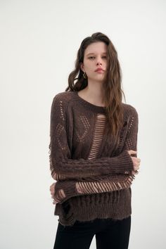 Lightweight knit Mixed pattern Distressed detail Relaxed fit Available in two colors Meticulously crafted from a wool-blend fabric, this sweater features a captivating distressed open knit pattern throughout. Slip into this piece and experience the whisper of the breeze against your skin, embracing an effortlessly breezy feel like never before. Brown Open Knit Crew Neck Sweater, Brown Oversized Open Knit Sweater, Oversized Brown Open Knit Sweater, Brown Open Knit Top For Fall, Brown Open Knit Top, Cozy Brown Open Knit Sweater, Brown Open Knit Sweater For Layering, Knit Pattern, Lightweight Sweater