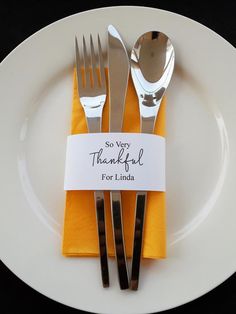 there is a white plate with silverware on it and a thank you for linda label