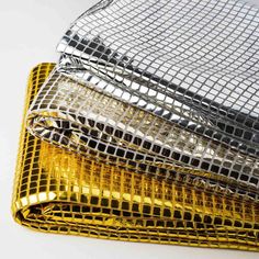 gold and silver mesh bags stacked on top of each other