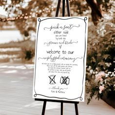 an easel with a sign that says welcome to our wedding