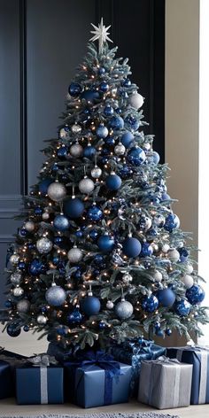 a christmas tree with blue and silver ornaments