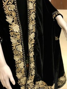 Complement your outfit with this Royal Velvet Cape. This is a very easy to style cape and it can be paired with any top, blouse, dress, or any other thing, no doubt you'll stand out from the crowd.Product DetailsCondition Brand New Velvet Cape with Golden & Silver Kashmiri Zari Embroidery.Colour: BlackSize: 82" X 35" (208.28 cms X 88.9 cms) approx.If you want a bigger or smaller size (dimensions), we can make it for you on order, just drop us a message.Care Instructions- Dry Clean Only.✿Subscrib Black Kaftan With Dupatta, Black Kaftan With Resham Embroidery Traditional Drape, Designer Embroidered Black Kaftan, Designer Black Embroidered Kaftan, Traditional Black Designer Kaftan, Formal Embroidered Kaftan With Traditional Drape, Elegant Black Kaftan With Chikankari Embroidery, Traditional Embroidered Formal Dupatta, Black Bohemian Traditional Wear With Floral Embroidery