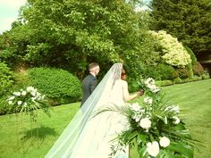 the bride and groom are looking at each other