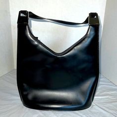 Vintage Gucci Black Patent Leather Bucket Bag Purse 90s Y2K Tom Ford era V top 1960s Gucci mod look Silver hardware Zipper closure Hard bottom Good Preowned Condition - Peeling and stickiness inside. Light scratches on hardware. Light wear on leather. Please see all pics for details Feel free to ask any questions, make an offer bundle for additional discount. I ship same day or next business day. Smoke & Pet free Home Thanks for shopping! Gucci Vintage Bucket Bag, Cardigan Grunge, 90s Bag, Mod Look, Leather Bucket Bag, Black Leather Bags, Leather Bucket, Gucci Black, Shoulder Handbag