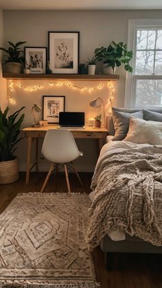 a bedroom with lights strung above the bed and rugs on the floor in front of it