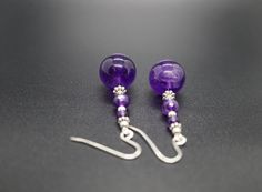 Amethyst Handmade Dangle Drop Earring Gem: amethyst Hook: silver, as shown Accessories: silver Dimensions: H 1.36'' W 0.55'' Treatments: untreated Color: as shown Clarity: transparent, some flaws inside Shape: as shown Please note the stone shade, color, and pattern may vary since we are working with genuine stones no two are alike. We look forward to the opportunity of serving you！ Elegant Earrings For Healing, Elegant Drop Earrings For Healing, Purple Long Drop Earrings With Ear Wire, Purple Long Drop Earrings As Gift, Nickel-free Amethyst Earrings For Healing, Purple Round Spiritual Earrings, Purple Spiritual Drop Earrings, Purple Long Drop Earrings For Gift, Elegant Dangle Crystal Earrings For Healing