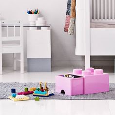 a child's room with toys on the floor