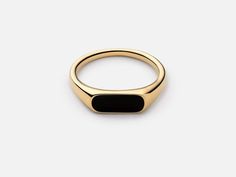 The men's Pax Ring features black onyx detailing on a thin sterling silver signet band. This piece fuses modernized materials with vintage inspired design to create a retro style that works for everyone. Handcrafted by our expert artisans, this ring will add a cool nostalgic feel to enhance an everyday look.  this design is as striking as it is sleek July Birthstone, Matching Band Ring Item Details Metal: 925 Sterling Silver Main stone creation- black onyx, opal , abalone (lab created) Main Stone Color: black Main Stone Shape: Baguette  Cutting technique-  bar Theme: Dainty, Statement & Engagement Method: handmade Personalization: Possible Occasion: Wedding ring, engagement ring, birthday ring, ring for her, proposal ring Style: Ring Size: We make rings from US 4 to US 15. (If you need sma Black Stone Signet Ring, Onyx Gold Ring, Signat Ring, Black Onyx Ring Gold, Black Signet Ring, Vintage Gold Ring, Onyx Signet Ring, Vintage Gold Rings, Birthday Ring