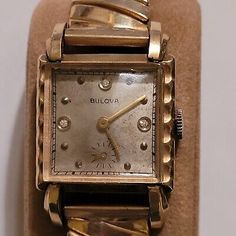 (eBay) It says it was made in the USA and the outer case says 10K Rolled RGP and stainless back. Band reads 1/20 - 10K TOP SS Back. Don't Let this Rare Gem Go. Sharp Looking Watch. Vintage Rectangular Diamond Watch With Diamond Hour Markers, Vintage Rectangular Jewelry With Diamond Hour Markers, Retro Gold Rectangular Watches, Antique Watch With Rectangular Dial For Anniversary, Antique Rectangular Dial Watch For Anniversary, Antique Gold Rectangular Jewelry And Watches, Antique Rectangular Watches For Anniversary, Antique Rectangular Quartz Watch, Antique Rectangular Quartz Watches