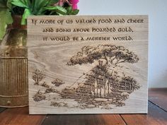 a wooden plaque with an image of a tree on it and the words if more of us valley food and cheer and song above trees, it would be a merier world