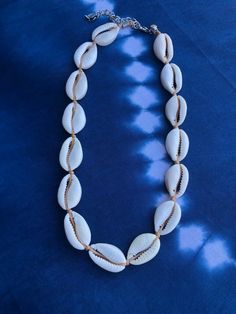 Hɑաɑííɑղ COWRIE shell choker * seashell necklace * unisex jewelry * beach choker * sմɾƒ girl * surf ցմվ * I will make your necklace today order. I will make it a standard length and add a chain so you can adjust it unless we otherwise agree on a length. Cheap Silver Shell Necklace, White Shell Choker Necklace For Beach, White Shell-shaped Choker For Vacation, White Shell Choker For Beach, White Strand Choker For Beach, White Shell Choker Necklace For Vacation, White Shell-shaped Choker For The Beach, White Shell-shaped Choker For Beach, Summer Beach Cowrie Shell Choker