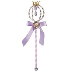 a purple wand with a crown on top and a ribbon around it's neck