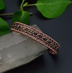 "There is nothing like a good cuff bracelet! Its feeling of indestructibility makes it a powerful, fashion accessory. 🌈 The bracelet is handcrafted by hand, antiqued with jewelry patina finish to enhance the work detail, hammered for more strength and polished by hand. Wire wrapped in Multi-Colored Tourmaline 0.4 mm beads,  a variety of tourmaline containing two or more colors displayed in one crystal. ... With colors ranging from green to  black. Tourmaline is a powerful grounding stone, elect Mens Copper Bracelet, Wire Jewelry Patterns, Wire Wrapped Jewelry Diy, Bijoux Fil Aluminium, Copper Cuff Bracelet, Wire Jewelry Designs, Tourmaline Bracelet, Wire Wrapped Bracelet, Diy Wire Jewelry