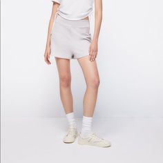 High-Waisted Shorts With Elastic Waistband. 100% Cotton Daywear Bottoms With Built-in Shorts, Casual White Bottoms With Waistband, White Bottoms With Wide Waistband, White Shorts With Waistband, Basic Relaxed Fit Summer Shorts, Trendy Relaxed Fit Solid Shorts, High Waist Bottoms With Wide Waistband For Daywear, High-waist Bottoms With Wide Waistband For Daywear, Sporty Bottoms With Banded Waist For Spring