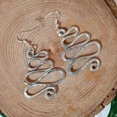 Buy any 2 Items and get a 3rd item at equal or lesser value FREE! JUST ADD FREE ITEM YOU WANT IN NOTE SECTION AT CHECKOUT. Aluminum Geometric Hoop Earrings. ❤️These Beautiful Statement, handcrafted earrings are made from aluminum wire and have been hammered to give them a nice textured finish. Aluminum is very lightweight on the earlobe, super hypoallergenic, and the perfect medium for dangle / drop earrings. ❤️ Great gift for mom, sister, daughter, girlfriend, or just simply for yourself. My ultimate goal is to make you feel beautiful & unique. Measurements: Dangle length from ear hook, is 2 1/2" approx. and are 1 1/2" in width. ❤️ If you have any questions, please don't hesitate to contact the shop. ❤️ I Thank You for visiting Rebeltude! Aluminum Earrings, Geometric Hoop Earrings, Abstract Earrings, Great Gifts For Mom, Ear Hook, Handcrafted Earrings, Free Items, Geometric Earrings, How To Feel Beautiful