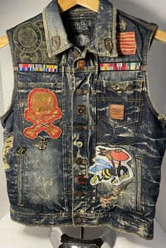 HERITAGE AMERICA Vests.......“ARMY”......... Men’s....... Size M ~ Medium........ Patches........ Denim....... Jean....... Jacket........  U.S. .....USPS Priority Mail $9.95........ Winter Streetwear Distressed Denim Vest, Distressed Denim Vest For Streetwear In Grunge Style, Distressed Grunge Denim Vest For Streetwear, Punk Denim Vest, Rugged Distressed Cotton Denim Jacket, Distressed Dark Wash Denim Vest For Streetwear, Dark Wash Distressed Denim Vest For Streetwear, Vintage Distressed Denim Vest For Fall, Vintage Distressed Denim Vest