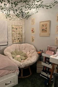 a bedroom with two beds and some pictures on the wall above them, along with other furniture