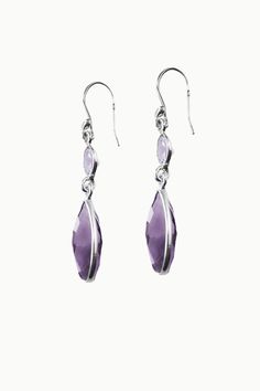 Real life will feel like a sweet dream in these delicate, crystal dangle earrings - Twilight. Brilliant cut Amethyst is paired with sparkling Purple and is bezel set in pure sterling silver for that luminous, effervescent glow. The iridescent hues of authentic crystals will help guide you towards the life you deserve, and are the perfect, magical finishing touch on all your outfits. Authentic Sivalya Amethyst Amethyst: Balance - Peace - Spirituality Hallmarked Metal: 925 Sterling Silver Gemstone Elegant Lavender Earrings With Ear Wire, Elegant Lavender Sterling Silver Earrings, Elegant Lavender Dangle Crystal Earrings, Elegant Lavender Earrings With Gemstone Accents, Elegant Lavender Crystal Dangle Earrings, Elegant Amethyst Dangle Earrings, Elegant Amethyst Dangle Crystal Earrings, Elegant Purple Crystal Pierced Earrings, Elegant Amethyst Teardrop Dangle Earrings