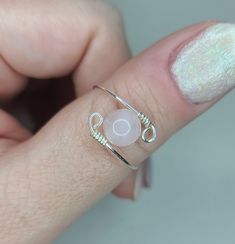 a woman's hand with a ring on it