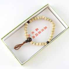 Bodhi Seed Wood & Brown Quartz Crystal Stone Bracelet Materials : Bodhi Tree Wood, Brown Quartz, Silk elastic cord Wrist size : about 6.7inch / 17cm We adjust the size to your wrist for a fee. Head beads : about 10mm / 10mm / 12mm Main beads : about 6.5mm / 8mm / 10mm Handmade in Kyoto, JAPAN Bodhi seeds are usually used without being polished so they have small ridges or veins showing and they are a solid color.It is believed that while Prince Siddhartha was sitting under a bodhi tree meditating, he became Buddha through enlightenment. The meaning of bodhi seeds is leading to peace and wisdom. In Japan, Buddhists have Prayer beads (Juzu, Nenju). Kyoto is famous as a producing center of Prayer beads. ※ The color may differ from the actual one depending on the coloration condition of the mo Adjustable Bracelets For Meditation And Festivals, Adjustable Rosary Bracelet For Healing With 108 Beads, Traditional White Braided Bracelets As Gift, Traditional Adjustable Bracelet With 8mm Beads, Adjustable Gold Mala With 8mm Beads, Adjustable Wooden Beads Rosary Bracelet For Meditation, Spiritual Gift Braided Mala Beads Bracelet, Traditional Rosary Bracelet For Meditation, Adjustable Traditional Rosary Bracelet For Meditation