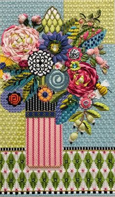 a cross stitch pattern with flowers in a vase on a tablecloth, which is multicolored