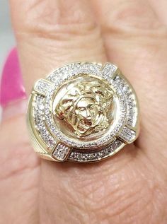 This sleek 10-karat yellow men's ring showcases a Medusa head and weighs 9 grams. The ring showcases .25 carats of sparkling round diamonds and shines with a high polish finish. Will come in a gift box. Diamonds: Genuine Round Cut Sparkling Diamonds Carats: .25ctw Color: G-H Clarity: SI2-SI3 Width: 19mm Height: 6mm Weight: 9 grams Hallmarked: 10kt Size: 10 (resize is available) 100% Satisfaction COMES WITH RING BOX Mall Price: $2,775.00 093021.39201SHCS.TCC.AV-247704Y Gold Diamond Cluster Ring Stamped 14k, Hallmarked Yellow Diamond Ring, Yellow Gold Round Signet Ring With Prong Setting, Gold Diamond Ring With Vs Clarity And Round Cut, Gold Cluster Diamond Ring, 14k Gold Yellow Rings With Diamond Accents, Yellow 14k Gold Rings With Diamond Accents, Yellow Gold Diamond Cut Signet Ring, Yellow Diamond Ring With Vvs Clarity