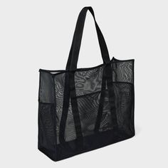 Whether it's time for a casual outing with friends or a trip to the farmers' market, you can carry all your essentials in the Mesh Tote Handbag from Shade & Shore™. This unstructured tote handbag has a mesh design to help you see through to the contents inside. It features an open main compartment along with front and side pockets to help keep water bottles and small items separate, and with the double handles, it's easy to carry over your shoulders or in hand. Shade & Shore™: Found exclusively Packable Rectangular Nylon Bag, Large Capacity Mesh Bags For Everyday Use, Black Rectangular Packable Bag, Packable Rectangular Black Bag, Casual Tote Travel Accessories For Daily Use, Summer Vacation Nylon Bags, Versatile Rectangular Packable Bag, Casual Lightweight Nylon Bags, Daily Use Packable Rectangular Travel Accessories