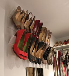 an image of shoes hanging on the wall using crown molding to store them for sale