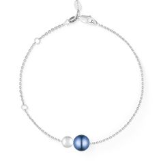 14K White Gold Slider Bracelet with a 5mm White Akoya Pearl and a 7mm Blue Akoya Pearl. The bracelet is adjustable to approximately 5.25", 6.25" and 7". Elegant Blue Oyster Bracelet, Elegant Adjustable Blue Gold Bracelet, Elegant Blue Adjustable Gold Bracelet, Elegant Blue Bracelets With Adjustable Chain, Elegant Blue Sterling Silver Chain Bracelet, Timeless Blue Round Bracelets, Elegant Blue Round Pearl Bracelet, Classic Blue Round Gold Bracelet, Elegant Blue Pearl Bracelet