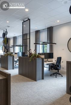 an empty office with desks and chairs