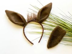 a pair of ears made out of fake grass