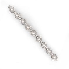 A classic and elegant platinum 950 bracelet adorned with white round fresh water pearls. Each pearl is placed within an octagonal frame adorned by round natural white diamonds 6.35 ct. Diamonds are white, natural and in G-H Color Clarity VS. The perfect mother's day gift. Length: 18.5 cm Width: 1.4 cm Weight: 258 g Diamond Cuff Bracelet, Platinum Bracelet, White Gold Bracelet, 18k Gold Jewelry, Fresh Water Pearls, Water Pearls, Pearl Diamond, White Diamonds, Mother's Day Gift