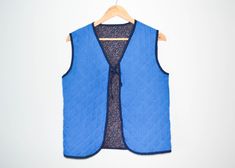 Blue Women's stepped Vest Steampunk Waistcoat Cotton stepped Vest Women Suede vest Sleeveless Blazer cotton waistcoat Towed on both sides blue or flower Estimated Size: Small   Measurements (lying flat): Length - 22 inch (56 cm) Pit to pit - 18.5 inch (47 cm) Please check measurements to insure a proper fit. Remember to allow yourself some extra room for movement. You can compare these with something from your closet that fits you well. Condition: good Vintage Condition SHIPPING * I ship worldwi Winter Cotton Sleeveless Vest, Blue Cotton Vest With Pockets, Sleeveless Cotton Denim Vest For Winter, Blue Cotton Vest For Spring, Steampunk Waistcoat, Sleeveless Blazer, Suede Vest, Vest Women, Vest Outfits