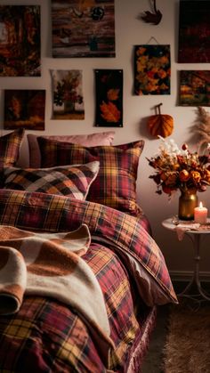 a bedroom with plaid bedding and fall decorations