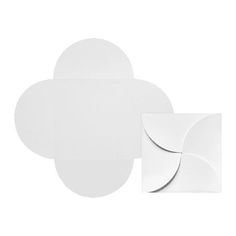 four white paper circles on a white background