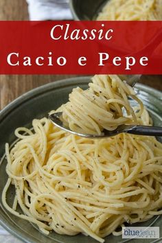 a bowl filled with pasta on top of a wooden table