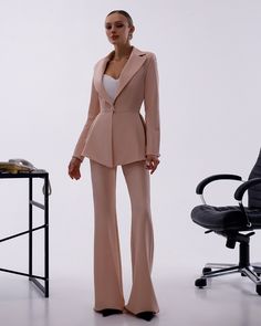 Please pay attention to suit measurements Pants total length is 115 cm or 45.2 inches (from waist to the bottom) Inseam length is 92 cm or 36.2 inches (from crotch to the bottom) Blazer length along the back 66 cm or 26 inches  Sleeve length is 62 cm or 24.4 inches 2-piece Womens Blazer Trouser Suit for office, business meetings, formal events and special occasions like civil wedding, elopement or birthday.  DETAILS -  flared pants -  side pockets -  slim fit   -  high rise -  blazer is buttoned -  lined -  peplum bottom MATERIAL Premium quality suiting fabric, which consists of viscose mostly and a bit of polyester and elastane SIZES The models in photos are wearing a size S (4 US numeric) Available in 4 sizes: XS= 2 US numeric BUST 32-34 inches or 82-86 cm WAIST 23-24.8 inches or 59-63 c Elegant Full-length Semi-formal Pantsuit, Elegant Semi-formal Full-length Pantsuit, Elegant High-waisted Wedding Pants, Chic Tailored Full-length Suits, Fitted Wide Leg Suits For Office, Fitted Formal Pantsuit With High-waisted Pants, Chic Tailored Suits, Elegant Fitted Pantsuit With Trousers, Fitted High-waisted Pantsuit For Formal Occasions