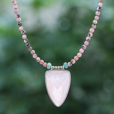 A translucent pink chalcedony triangle centers this lovely necklace designed by Thailand's Somluck Komolmith. The artisan hand threads pink rhodonite green jasper and 18k rose gold-plated brass beads to create the necklace then finishes the strand with a sterling silver clasp and extender chain. Pink Rhodonite, Pink Chalcedony, Green Jasper, Brass Beads, Lovely Necklace, Spring Rings, Necklace Designs, Rose Gold Plates, Jewelry Shop