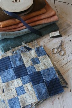 a table topped with lots of different types of cloth