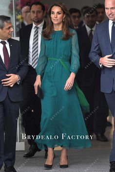 the duke and princess of cambridge are seen walking through an airport with other people behind them