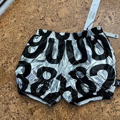 Silver With Black Numbers. Bubble Shorts With Elastic Waist And Hem. Has Pockets! Gender Neutral. Casual Metallic Shorts, Bubble Shorts, Black Numbers, Yoga Shorts, Kids Bottoms, Black Silver, Gender Neutral, Elastic Waist, Yoga