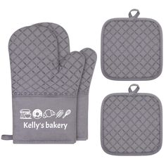 three oven mitts with the words kelly's bakery printed on them, and an oven mitt