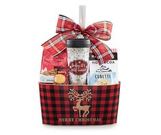 a christmas gift basket filled with coffee and snacks