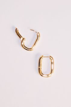 "Sleek and shiny with their high polish finish, these minimal rectangular huggie hoop earrings will elevate your everyday look! Dimensions: 1\" x 3/4\" Materials: Alloy, 18k Gold Plating Ships in a branded jewelry pouch and box, perfect for gift giving!" Ear Huggies Hoop, Gold Oblong Hoop Earrings For Everyday, Gold Rectangular Minimalist Huggie Earrings, Classic Rectangular Huggie Earrings For Everyday, Gold Oblong Huggie Earrings For Everyday, Gold Rectangular Huggie Earrings For Everyday, Everyday Gold Square Huggie Earrings, Everyday Gold Rectangular Hoop Earrings, Rectangular Yellow Gold Hoop Earrings For Everyday