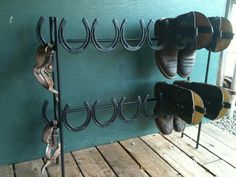 several pairs of shoes are hanging on a rack