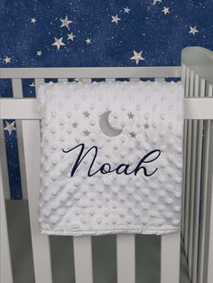 a baby crib with a name and stars on it