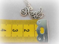 A gorgeous calligraphy charm writing Angel, with a small heart in the middle.It is so elegant cute and beautiful! **This listing is for a silver plated / gold plated angel charm with a rhodium plated or gold plated chain** ##IMPORTANT!##Please inform me at the checkout what item you want, and what size you wish your chain to be. I have 16'' chains and 18'' chains AVAILABLE. Sterling silver charm and chain also available - Cost 25 dollars.Contact me for custom orders..:) Personalized Inspirational Sterling Silver Charm Necklace, Meaningful Hand Stamped Sterling Silver Charm Necklaces, Inspirational Personalized Sterling Silver Charm Necklace, Meaningful Hand Stamped Sterling Silver Charm Necklace, Personalized Inspirational Silver Charm Necklaces, Inspirational Sterling Silver Nickel-free Charm Necklaces, Sterling Silver Hand Stamped Pendant Charm Necklace, Inspirational Sterling Silver Nickel-free Charm Necklace, Elegant Silver Hand Stamped Charm Necklaces