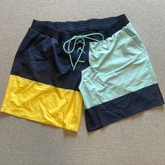 Brand New 7” Board Shorts From Tomboy X. Size 3x. Navy, Turquoise, And Yellow. Yellow Color Block Bottoms For Summer, Green Color Block Short Bottoms, Blue Color Block Shorts For Beach, Green Color Block Beach Bottoms, Green Color Block Bottoms For Beach, Sporty Yellow Color Block Bottoms, Green Color Block Casual Shorts, Green Casual Color Block Shorts, Casual Green Color Block Shorts