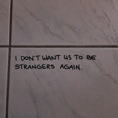 i don't want us to be strangers again written on the wall in a public restroom